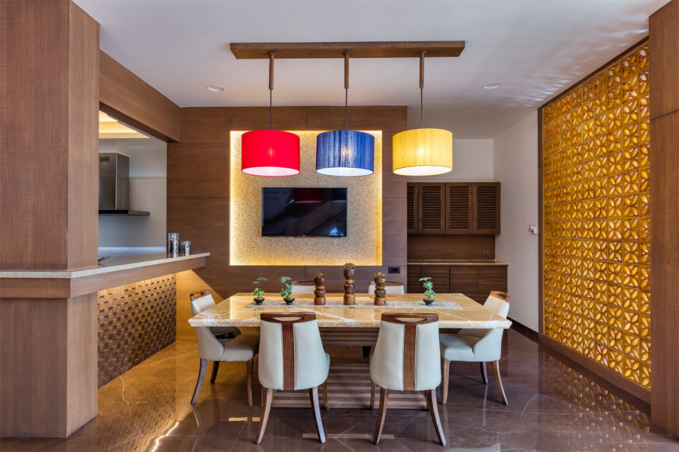 Design ideas for a contemporary dining room in Ahmedabad.
