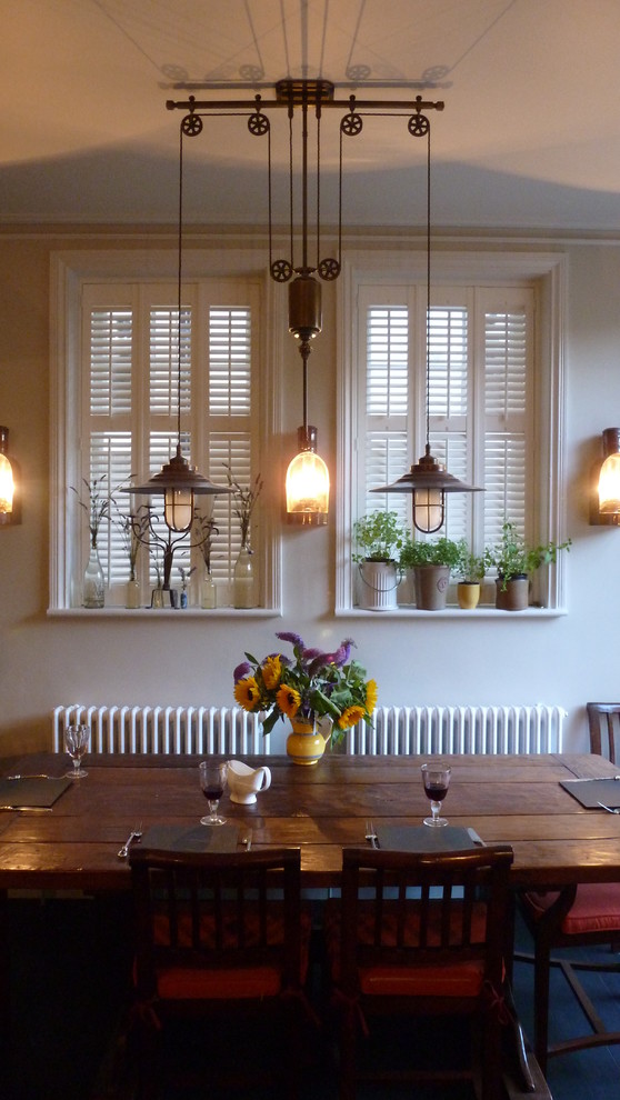 This is an example of a bohemian dining room in Sussex.