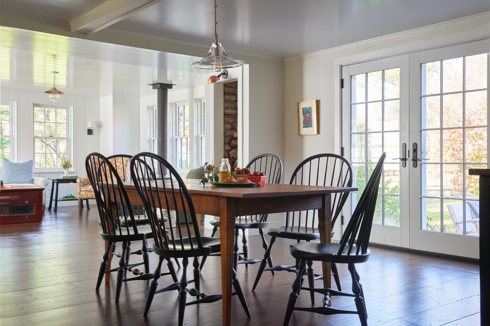 Inspiration for a large rural kitchen/dining room in New York with dark hardwood flooring, brown floors and white walls.