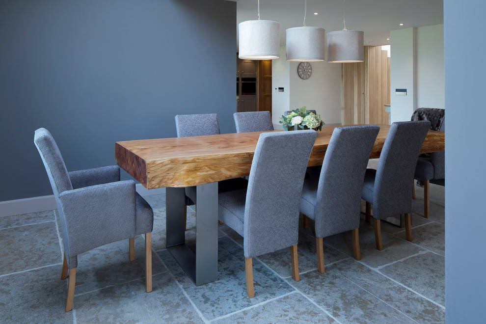 Design ideas for a large contemporary dining room in Cheshire with grey walls, limestone flooring and a plastered fireplace surround.