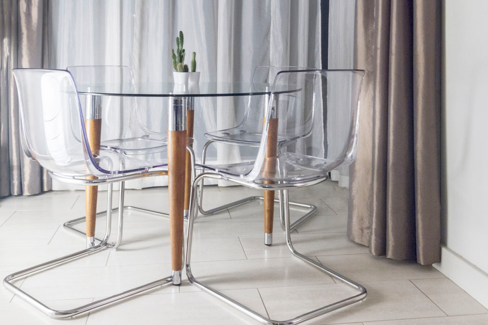 Photo of a contemporary open plan dining room in Dublin with grey walls, porcelain flooring and beige floors.