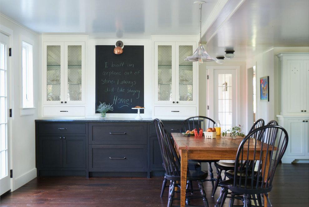 Example of a large cottage dark wood floor and brown floor kitchen/dining room combo design in New York with white walls