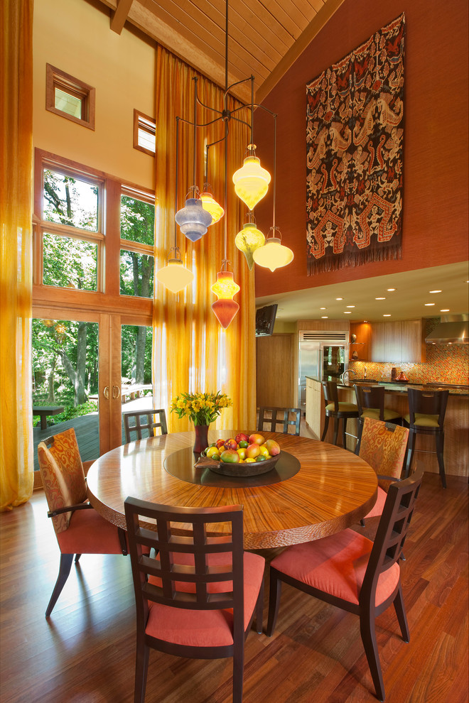 Large trendy medium tone wood floor kitchen/dining room combo photo in Minneapolis with yellow walls and no fireplace