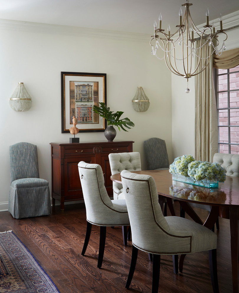 Photo of a medium sized classic dining room in Chicago with white walls and dark hardwood flooring.