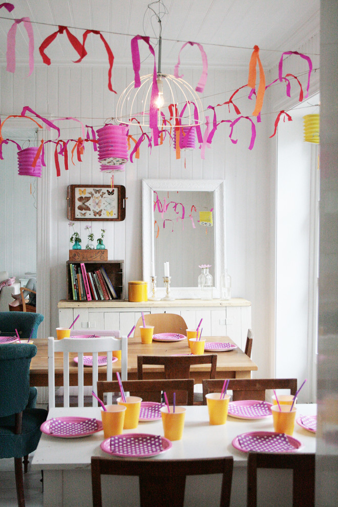 Eclectic dining room photo in Other with white walls