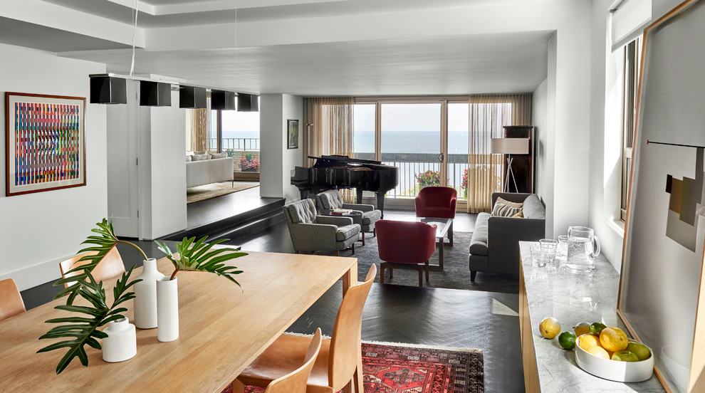 This is an example of a medium sized contemporary kitchen/dining room in Chicago with dark hardwood flooring.