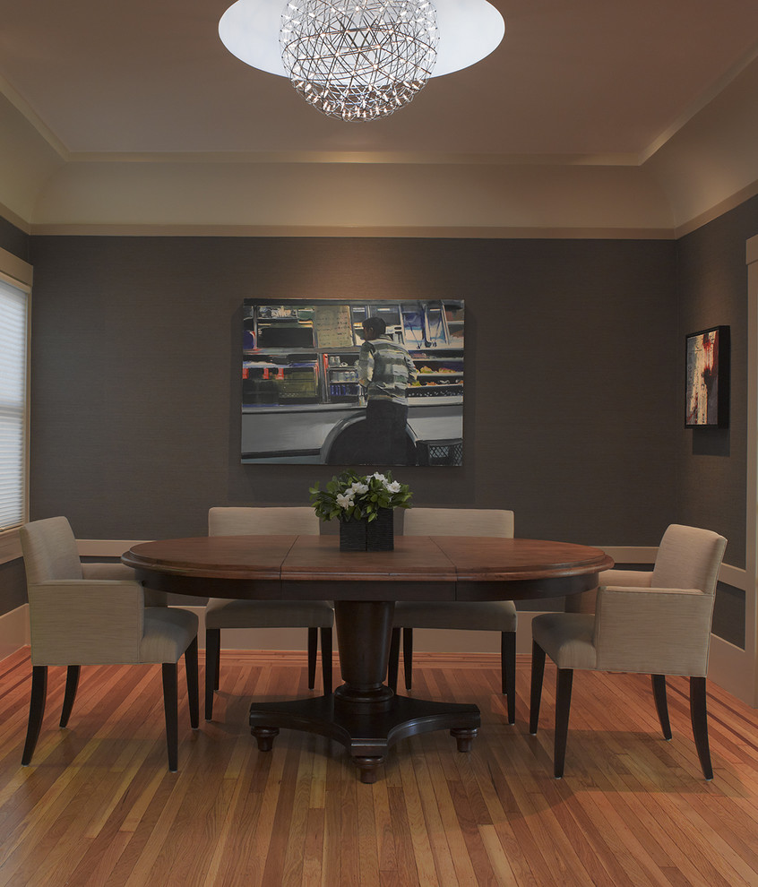 Photo of a contemporary dining room in San Francisco with grey walls and medium hardwood flooring.