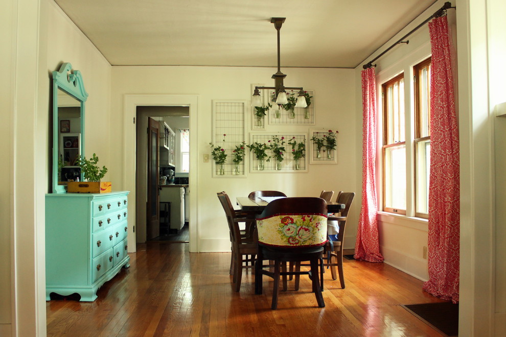 Inspiration for an eclectic dining room remodel in Albuquerque with white walls