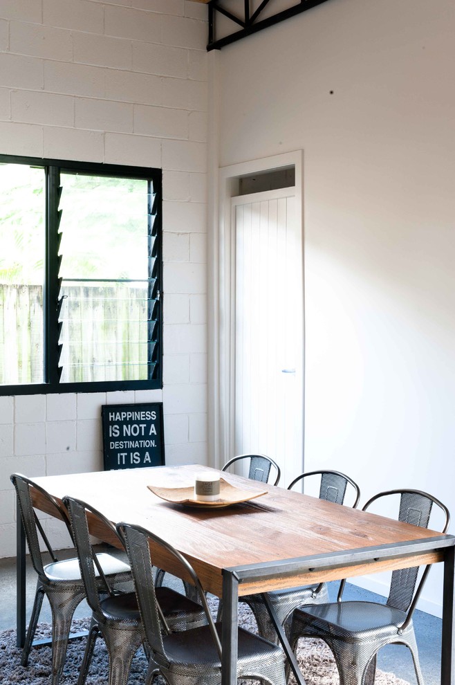 Great room - mid-sized industrial concrete floor great room idea in Gold Coast - Tweed with white walls