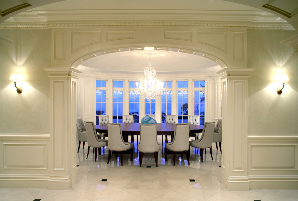 Photo of a traditional enclosed dining room in Toronto with white walls and marble flooring.