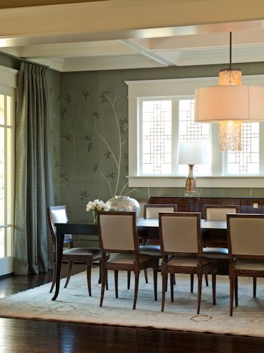 Contemporary dining room in Atlanta with green walls and dark hardwood flooring.