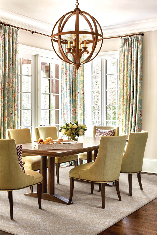 Photo of a traditional dining room in Little Rock with beige walls, medium hardwood flooring and brown floors.