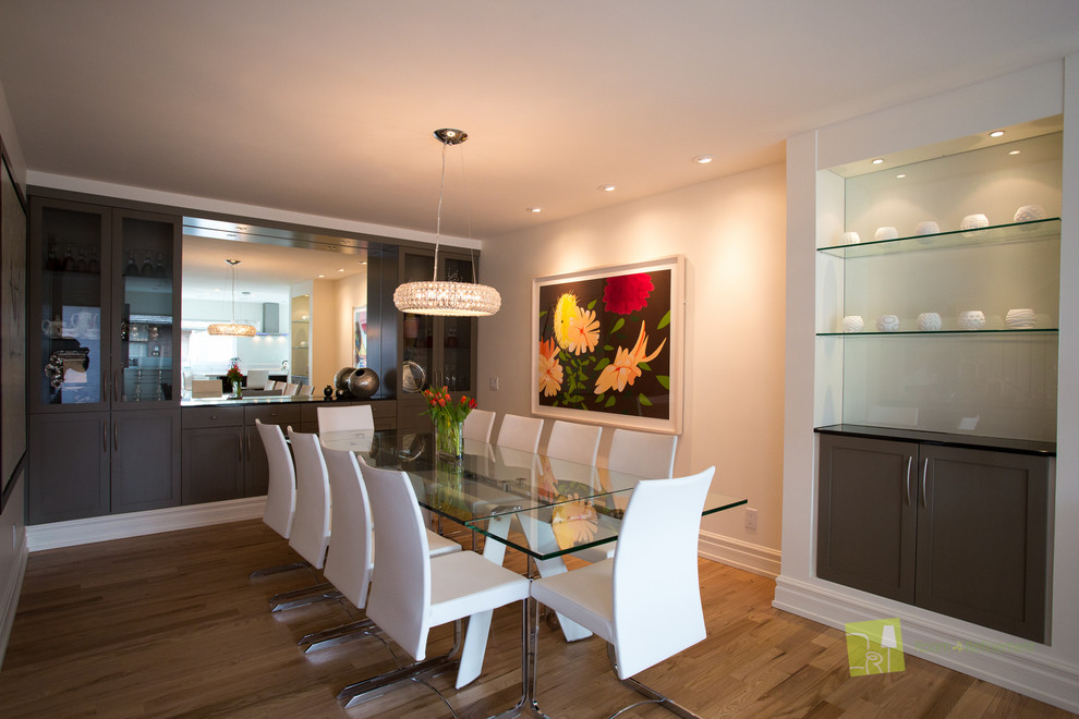 Inspiration for a medium sized modern enclosed dining room in Calgary with white walls and light hardwood flooring.