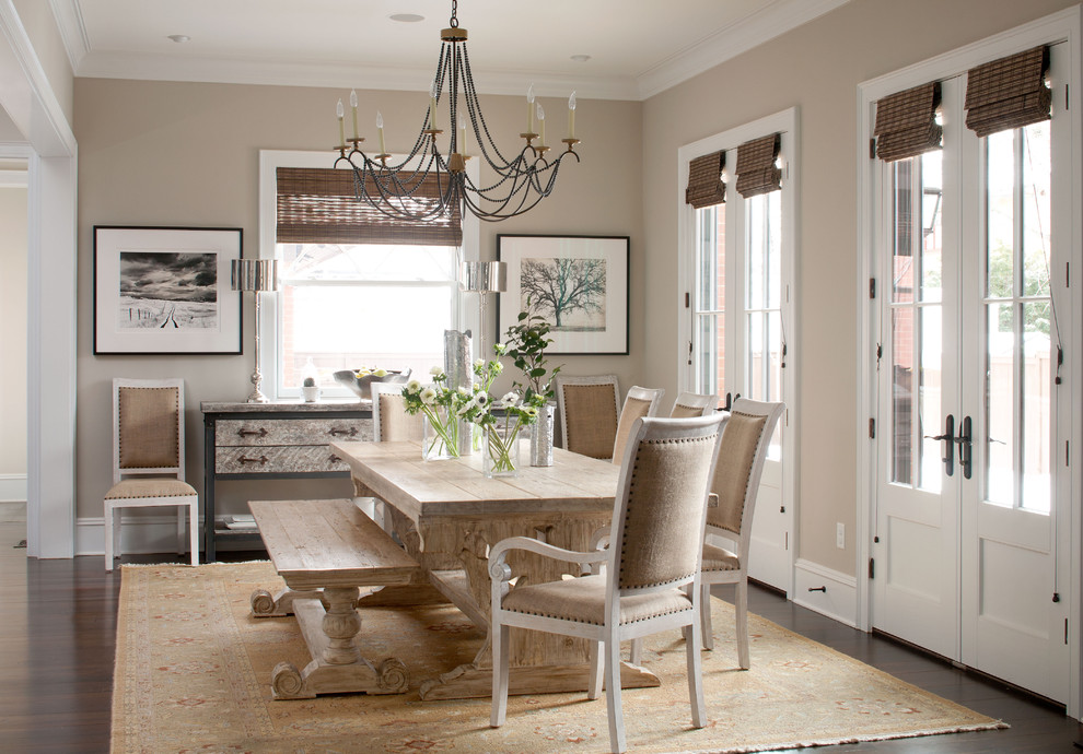 Example of a classic dark wood floor dining room design in Denver with beige walls