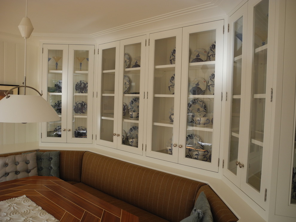 This is an example of a medium sized classic enclosed dining room in San Diego with white walls.