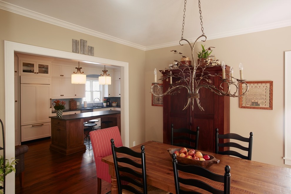 Medium sized rural kitchen/dining room in Minneapolis with beige walls, medium hardwood flooring and brown floors.