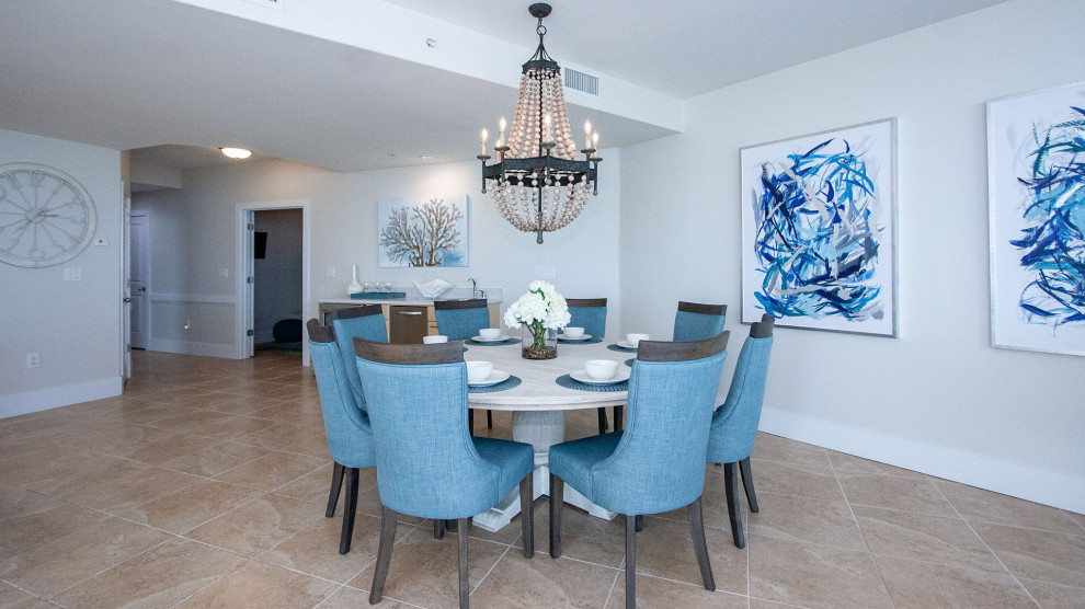 Inspiration for a large coastal open plan dining room in Austin with white walls, porcelain flooring and beige floors.