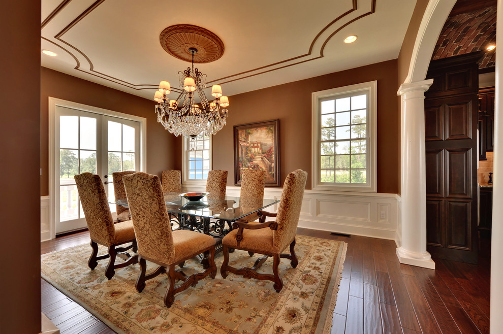 Inspiration for a mediterranean dining room in Philadelphia with brown walls and dark hardwood flooring.