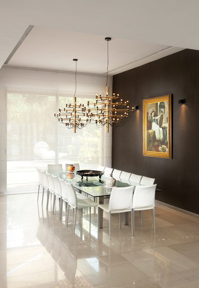 Example of a trendy marble floor and beige floor dining room design in Other with black walls