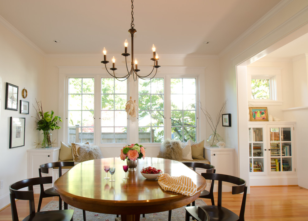 Classic dining room in Portland with beige walls and medium hardwood flooring.