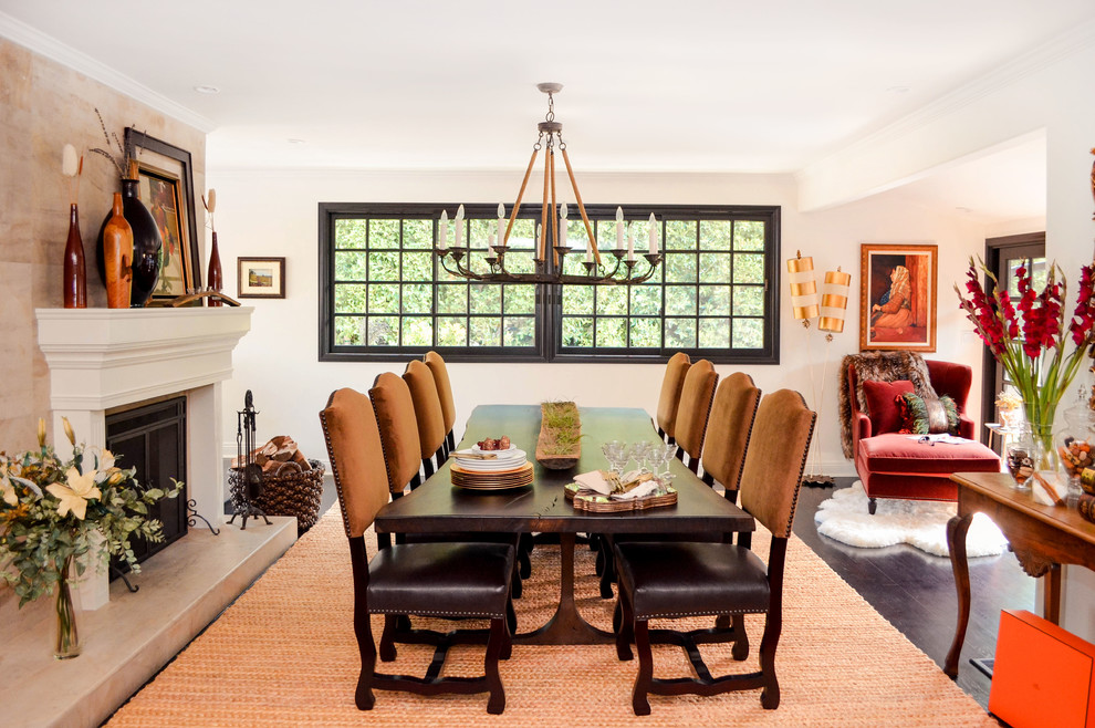 Example of a huge tuscan dark wood floor and brown floor great room design in Los Angeles with white walls, a standard fireplace and a stone fireplace
