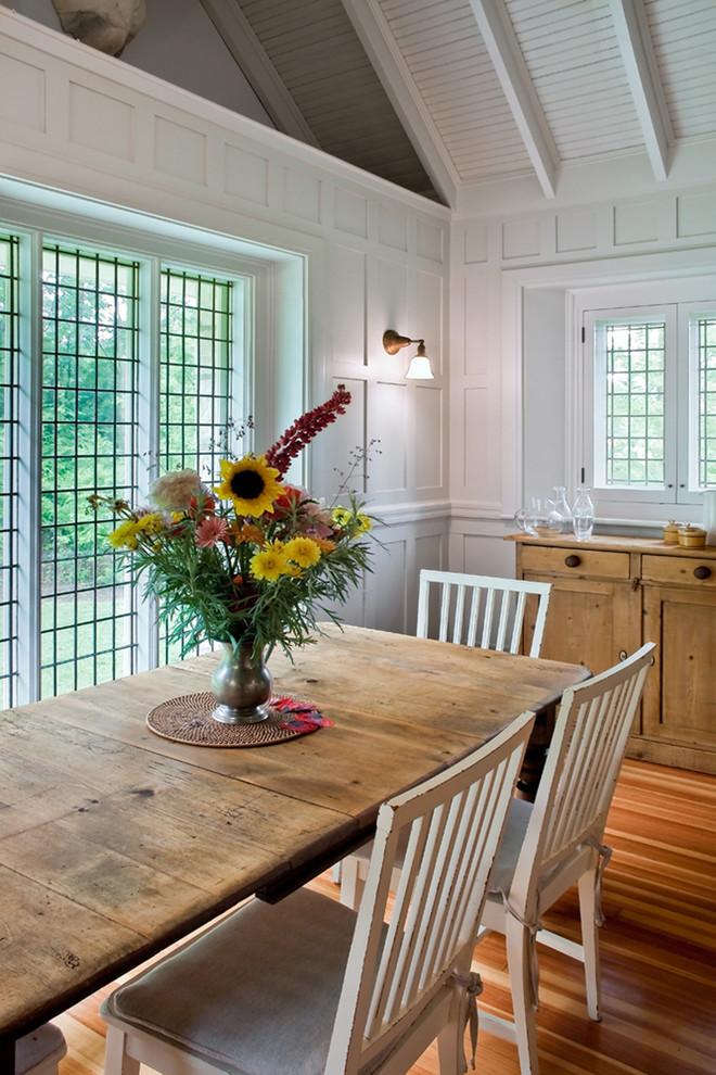 Eclectic dining room photo in Boston with white walls