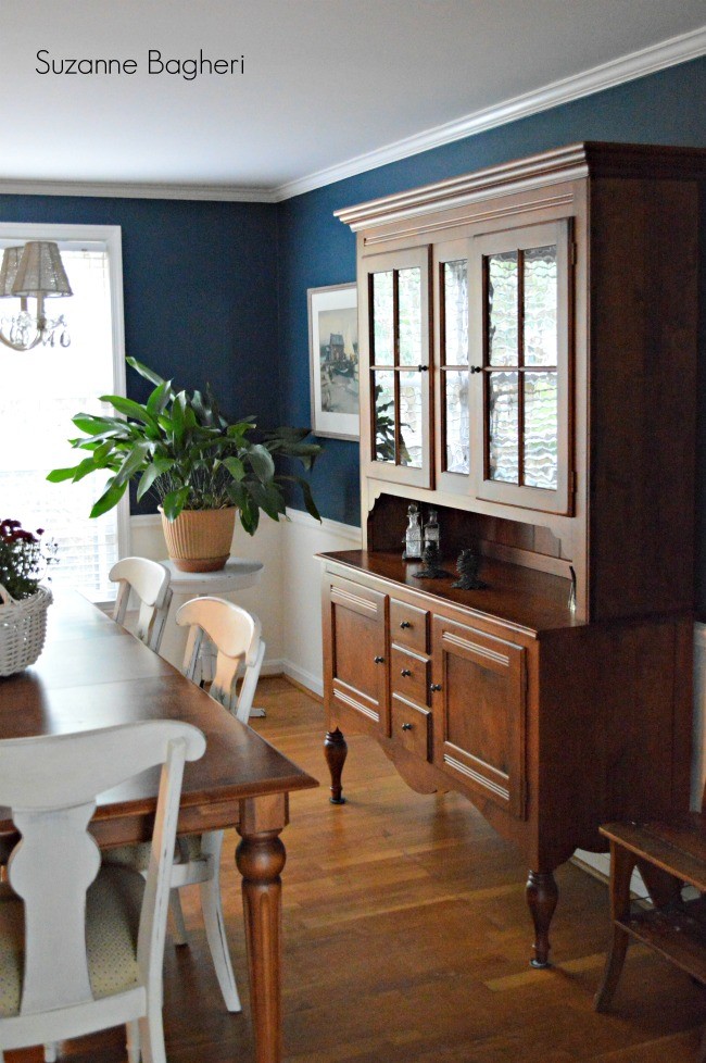 Example of a mid-sized classic medium tone wood floor enclosed dining room design in DC Metro with blue walls and no fireplace