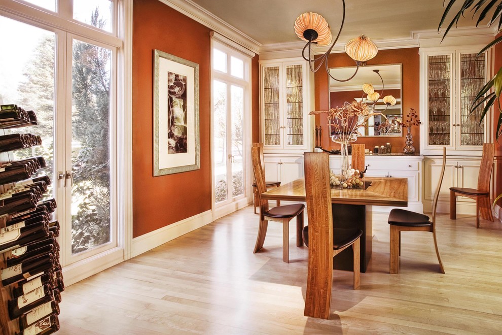 Dining room - contemporary light wood floor and beige floor dining room idea in San Francisco with brown walls