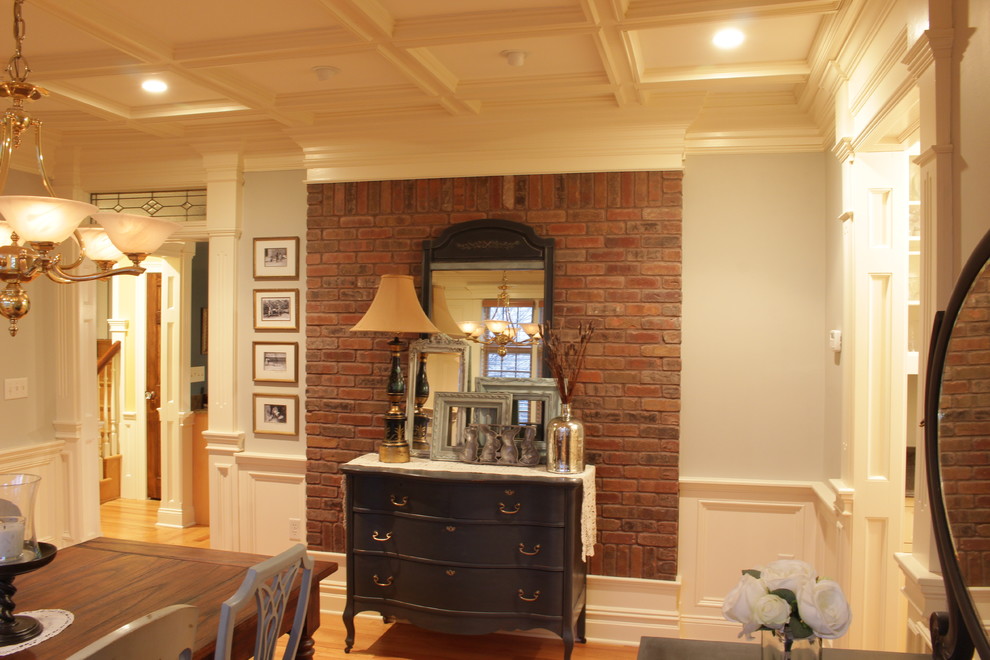 This is an example of a large traditional enclosed dining room in New York with grey walls, medium hardwood flooring, no fireplace and brown floors.