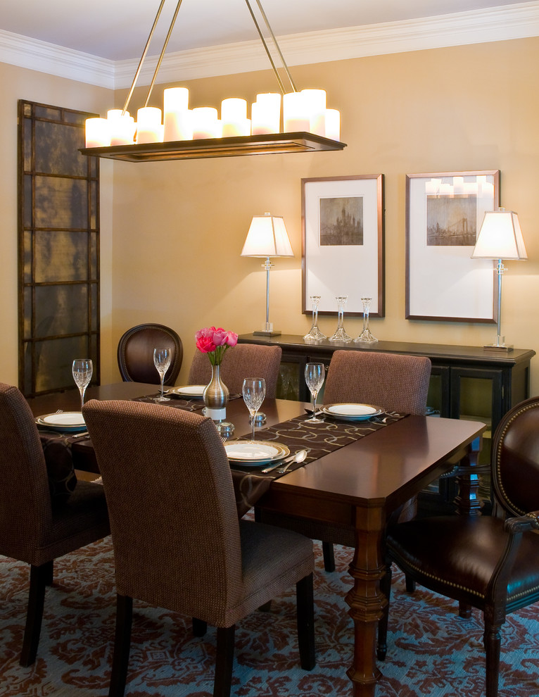 Medium sized traditional enclosed dining room in DC Metro with beige walls, no fireplace and feature lighting.