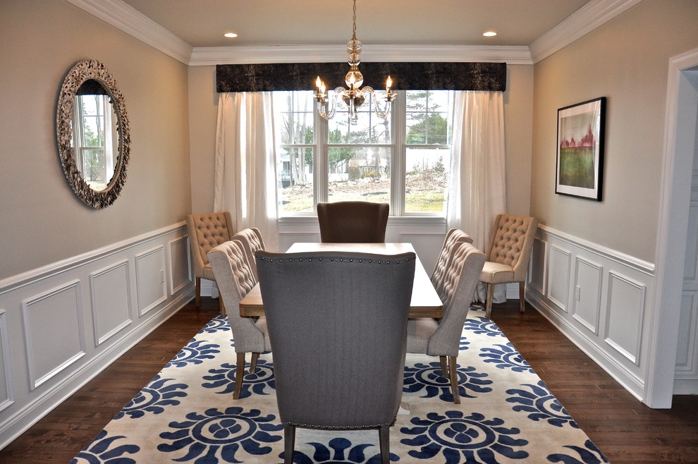 Example of a large cottage chic light wood floor and brown floor enclosed dining room design in Boston with gray walls