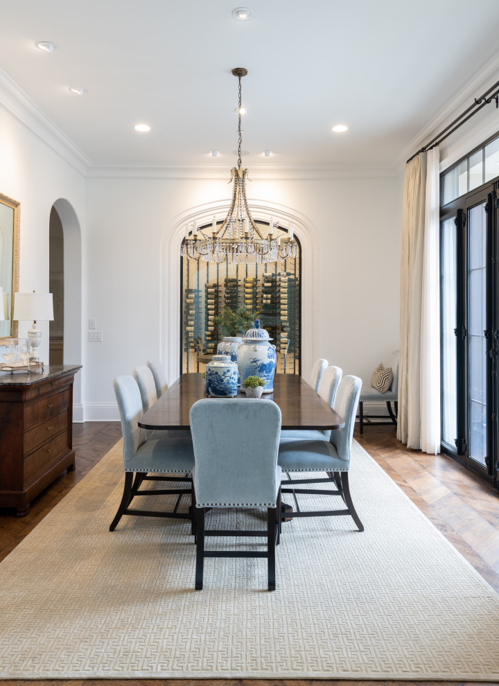 Photo of a large classic enclosed dining room in Dallas with white walls, medium hardwood flooring, no fireplace and brown floors.