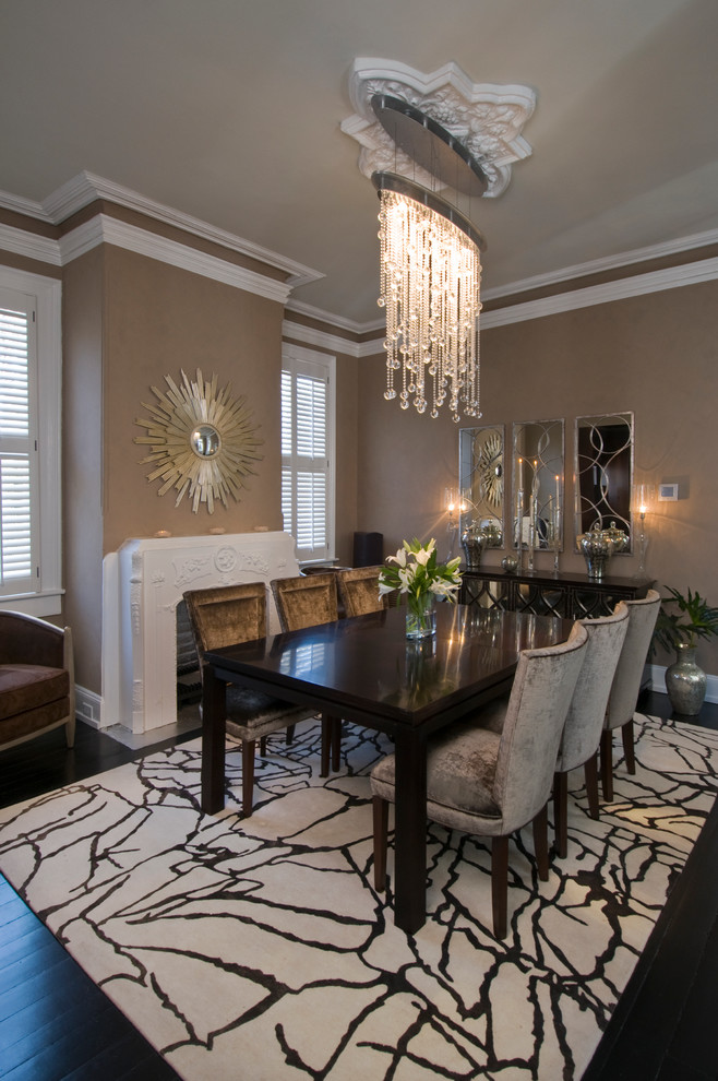 This is an example of a medium sized classic enclosed dining room in San Francisco with beige walls, dark hardwood flooring, a standard fireplace and a plastered fireplace surround.