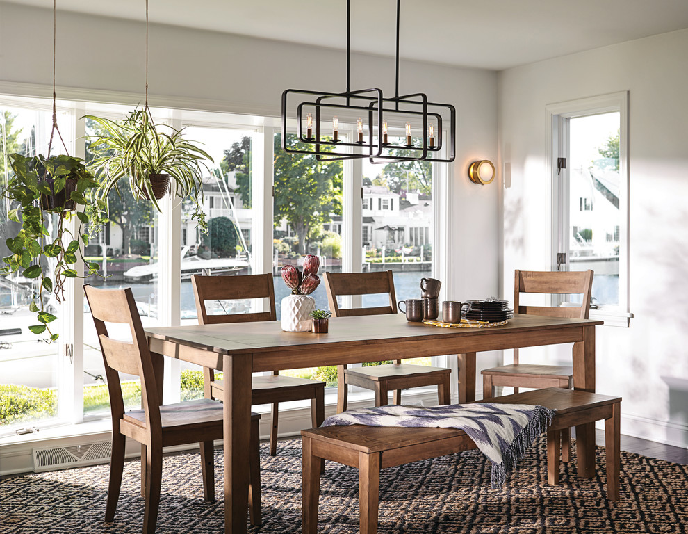 Inspiration for a mid-sized cottage medium tone wood floor and brown floor dining room remodel in Philadelphia with white walls and no fireplace