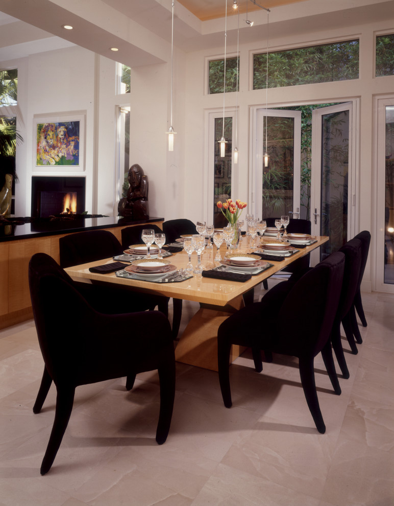 Design ideas for a medium sized modern open plan dining room in Orange County with white walls, porcelain flooring, a standard fireplace, a plastered fireplace surround and beige floors.
