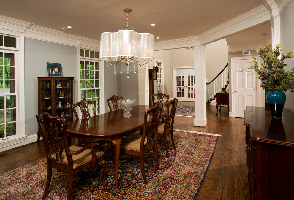 Great room - large traditional dark wood floor great room idea in DC Metro with gray walls