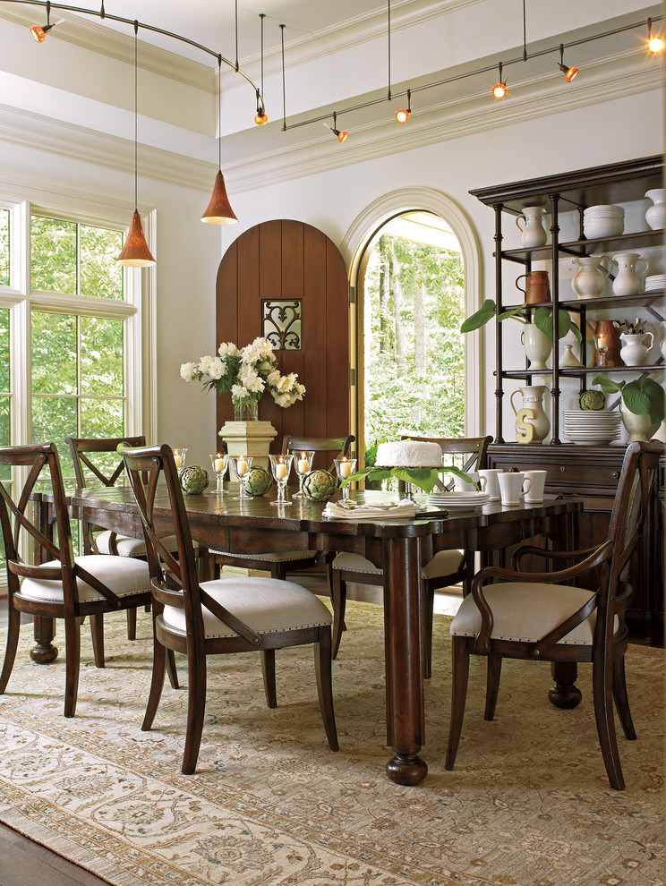 Example of a large classic dark wood floor enclosed dining room design in San Francisco with white walls
