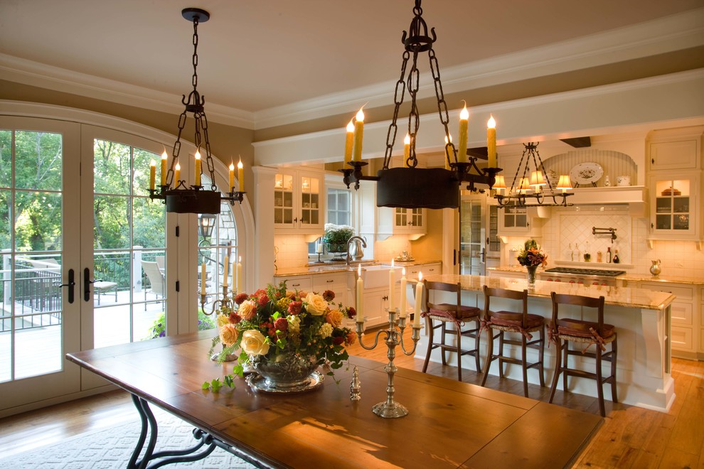 Example of a classic medium tone wood floor and brown floor kitchen/dining room combo design in Minneapolis