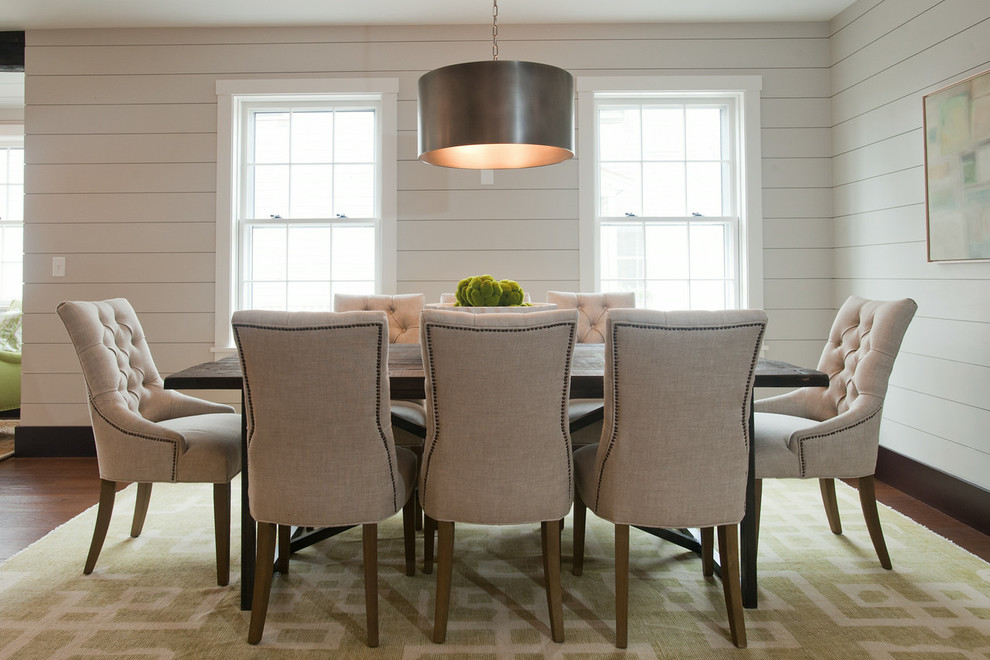 Design ideas for a coastal dining room in Boston with dark hardwood flooring.