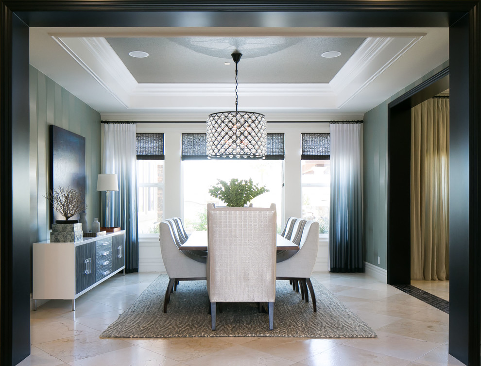 Inspiration for a contemporary dining room in Orange County with feature lighting.