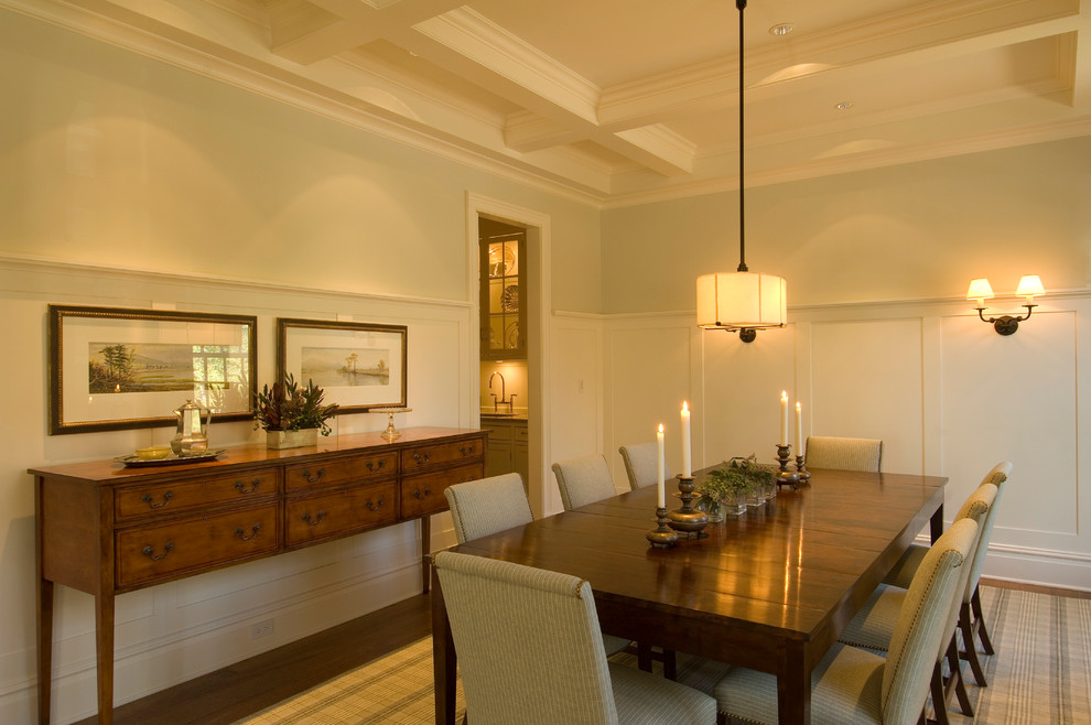 Photo of a medium sized classic enclosed dining room in Chicago with green walls, medium hardwood flooring and no fireplace.