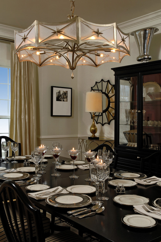 Photo of a classic dining room in DC Metro with beige walls and feature lighting.