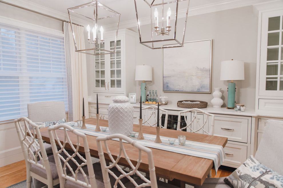 Medium sized beach style open plan dining room in Boston with grey walls and light hardwood flooring.