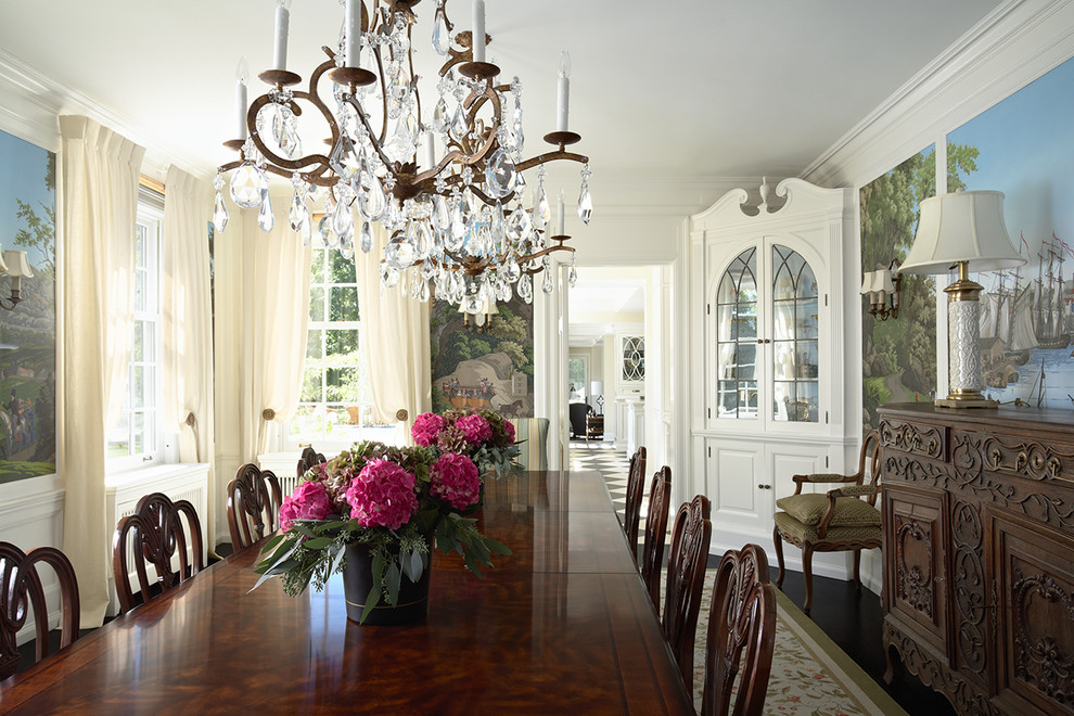 Photo of a medium sized traditional enclosed dining room in Minneapolis with dark hardwood flooring and white walls.