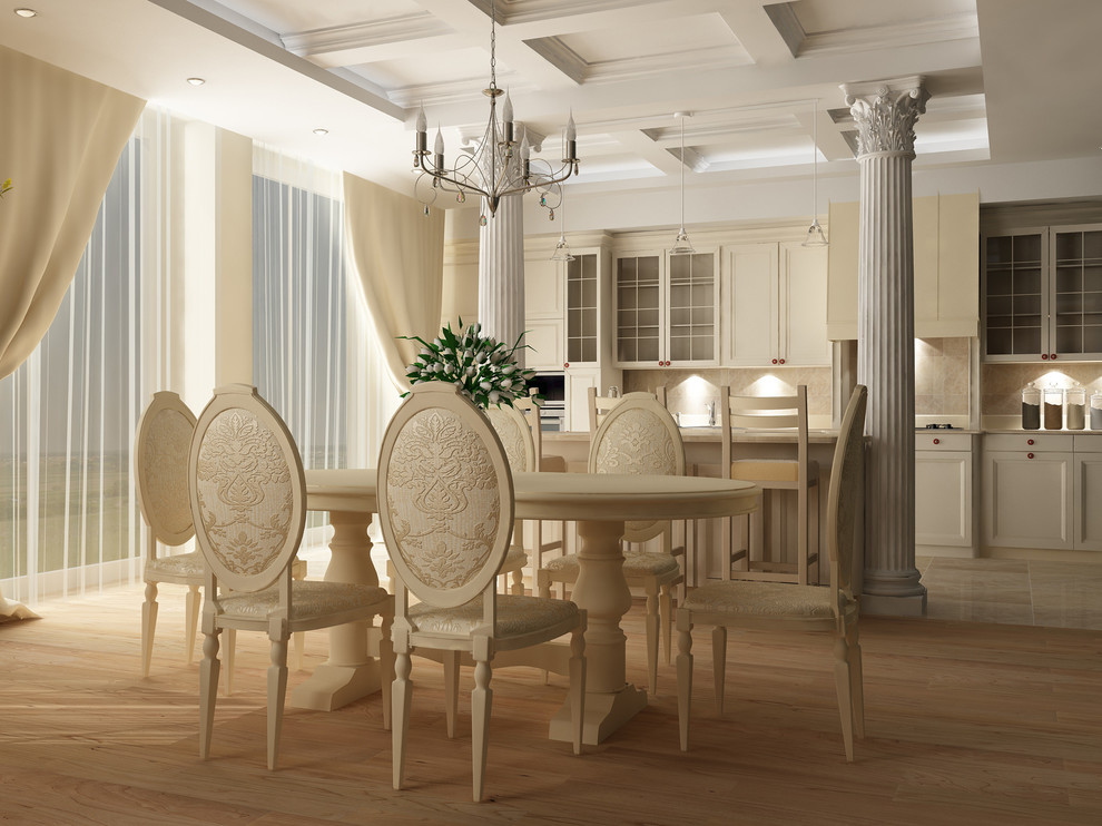 Ispirazione per una sala da pranzo aperta verso la cucina vittoriana di medie dimensioni con pareti bianche, pavimento in legno massello medio e pavimento marrone