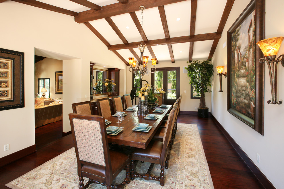 Example of a tuscan dining room design in Orange County