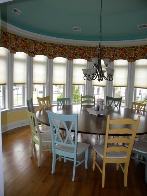 Enclosed dining room - large coastal medium tone wood floor enclosed dining room idea in Philadelphia with yellow walls and no fireplace