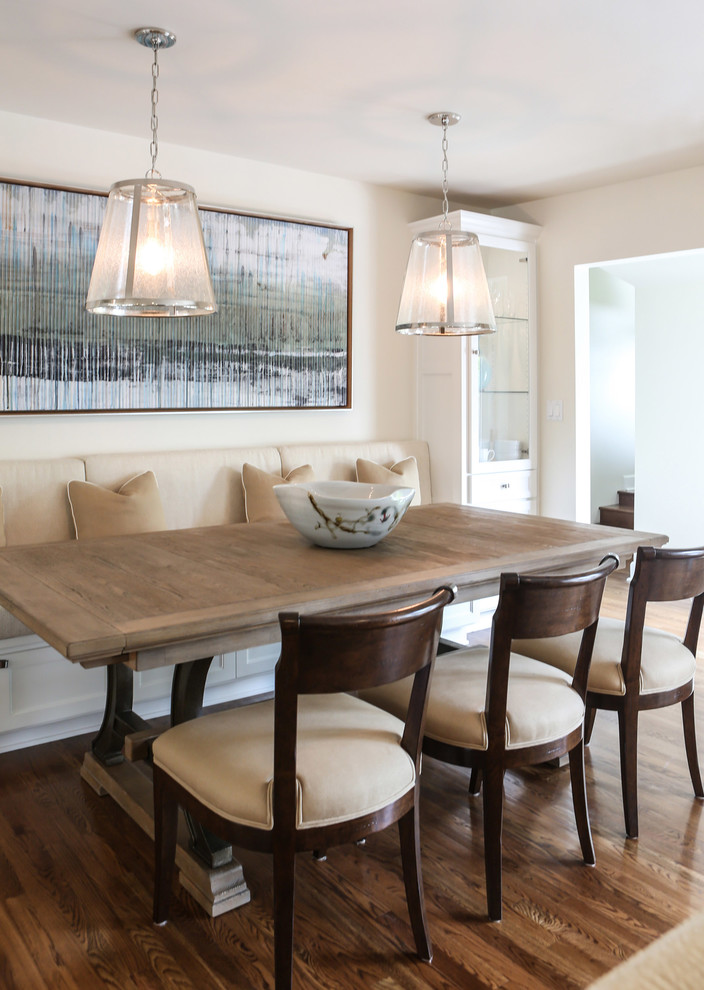 Photo of a medium sized traditional open plan dining room in Los Angeles with white walls and medium hardwood flooring.
