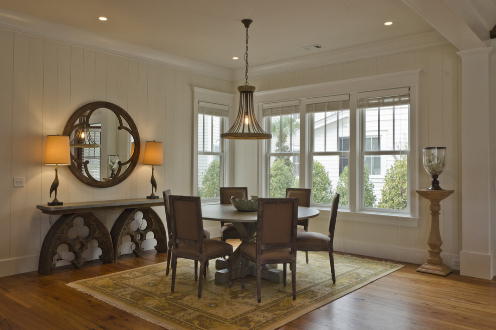 Inspiration for a rustic dining room in Charleston with white walls and medium hardwood flooring.