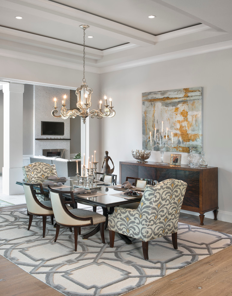 Inspiration for a mid-sized transitional light wood floor dining room remodel in Miami with gray walls and no fireplace